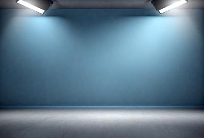 The primary subject of the image is a large, empty room with a blue wall. The setting is a clean, white room with a blue wall, and the visual style is a photo. The colors and mood of the image are predominantly blue, creating a calm and serene atmosphere.