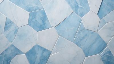 The primary subject of the image is a blue and white tile wall. The setting is a bathroom, as indicated by the presence of tiles. The visual style is a close-up of the tiles, showcasing their intricate design. The dominant colors are blue and white, creating a clean and calming atmosphere.