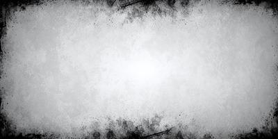 The primary subject of the image is a white background with a black and white pattern. The setting is a white wall, and the visual style is a black and white photo. The colors and mood of the image are predominantly black and white, creating a classic and timeless atmosphere.