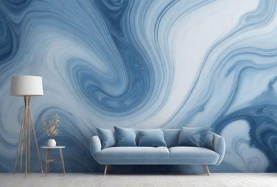 The primary subject of the image is a blue couch with a patterned wallpaper behind it. The setting is a living room with a table and a vase placed nearby. The visual style is a photo, and the colors and mood are predominantly blue, creating a calm and relaxing atmosphere.