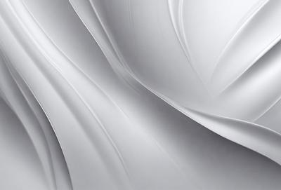 The primary subject of the image is a white sheet of paper, which is the main object, scene, or focus of the image. The setting or background is a white surface, which creates a clean and minimalistic appearance. The visual style of the image is a close-up of the white paper, showcasing its texture and details. The colors and mood of the image are predominantly white, giving it a calm and serene atmosphere.