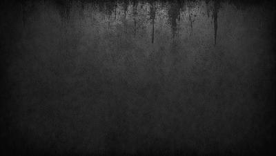 The primary subject of the image is a black and white photo of a wall. The setting is a dark room, and the visual style is a close-up of the wall. The colors and mood of the image are predominantly dark and moody, with the black and white color scheme adding to the atmosphere.