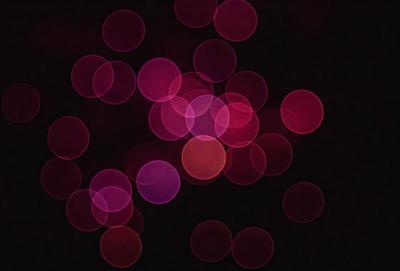 The primary subject of the image is a close-up of a pink and purple light show, with a focus on the bright and colorful lights. The setting is a dark background, which contrasts with the vibrant colors of the lights. The visual style is a combination of a photo and digital art, creating a unique and eye-catching effect. The colors and mood of the image are predominantly pink and purple, giving it a warm and inviting atmosphere.