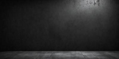 The primary subject of the image is a black wall with a gray background. The setting is a room with a black wall, and the visual style is a photo. The dominant colors are black and gray, creating a moody atmosphere.