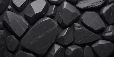 The primary subject of the image is a large collection of black rocks. The setting is a black background, which creates a striking contrast with the rocks. The visual style is a close-up of the rocks, showcasing their unique shapes and textures. The dominant colors are black, which creates a dramatic and moody atmosphere.