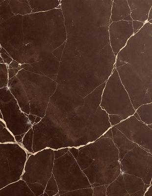 The image features a brown marble countertop with a unique, textured surface. The countertop appears to be made of marble, giving it a luxurious and elegant appearance. The countertop is the primary subject of the image, and it is set against a backdrop of a room. The visual style of the image is a close-up of the marble countertop, showcasing its intricate texture and design. The colors and mood of the image are warm and sophisticated, with the brown marble