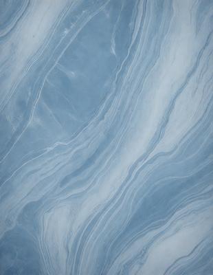 The primary subject of the image is a blue and white marbled tile. The setting is a bathroom, as the tile is placed on a wall. The visual style is a photo, capturing the intricate patterns and textures of the marbled tile. The dominant colors are blue and white, creating a calm and soothing atmosphere in the bathroom.