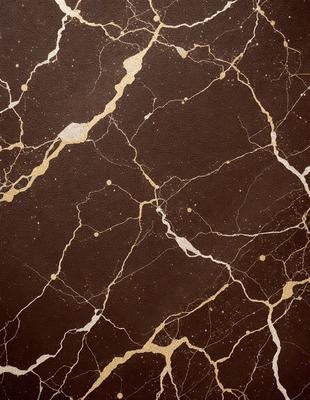 The primary subject of the image is a marble wall with a gold-colored pattern. The setting is a room with a brown background. The visual style is a close-up of the marble wall, showcasing the intricate gold pattern. The colors and mood of the image are warm and elegant, with the gold pattern adding a touch of luxury to the marble wall.