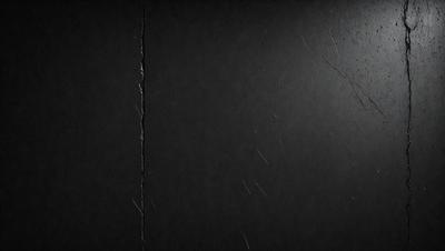 The primary subject of the image is a black wall with a crack in it. The setting is a dark room, and the visual style is a close-up of the wall. The colors and mood of the image are predominantly dark and moody, with the crack in the wall adding a sense of imperfection to the otherwise uniform surface.