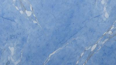 The primary subject of the image is a blue marble wall with a pattern of white swirls. The setting is a room with a blue marble floor. The visual style is a close-up of the marble wall, showcasing the intricate pattern of the swirls. The colors and mood of the image are predominantly blue, creating a calm and serene atmosphere.