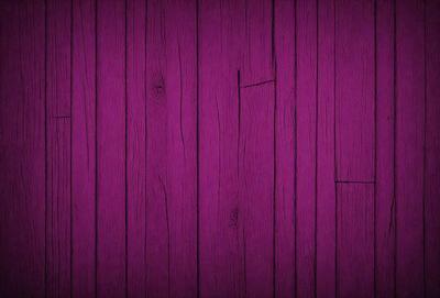 Purple wall with wooden planks.