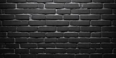 The primary subject of the image is a brick wall. The setting is a black background, which creates a stark contrast with the brick wall. The visual style is a close-up of the brick wall, showcasing its texture and details. The colors and mood of the image are predominantly black, giving it a moody and dramatic appearance.
