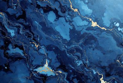 The primary subject of the image is a blue and gold marbled stone. The setting is a blue and gold marbled stone wall, which serves as the background. The visual style is a close-up of the marbled stone, showcasing its intricate patterns and colors. The dominant colors are blue and gold, creating a rich and luxurious atmosphere.