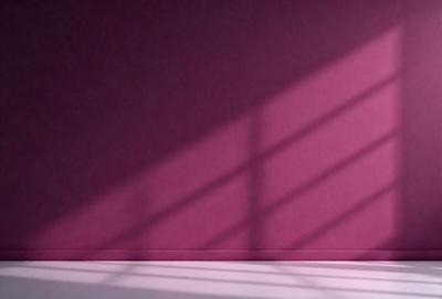 The primary subject of the image is a wall with a pink background. The setting is a room with a window, and the visual style appears to be a photo. The colors and mood of the image are predominantly pink, creating a warm and inviting atmosphere.
