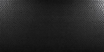 The primary subject of the image is a black background with a pattern of small holes. The setting is a dark room, and the visual style is a close-up of the pattern. The colors and mood of the image are predominantly dark and moody, with the small holes creating a sense of depth and intrigue.