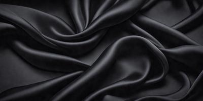 The primary subject of the image is a black fabric, which is the main object, scene, or focus of the image. The setting/background consists of a black background, which provides a contrasting and dramatic effect. The visual style of the image is a close-up of the fabric, showcasing its texture and details. The colors and mood of the image are predominantly black, creating a moody and dramatic atmosphere.
