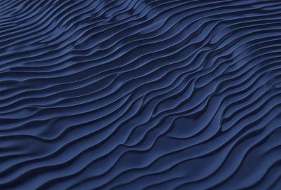 The primary subject of the image is a blue ocean with waves. The setting is the ocean, and the visual style is a photo. The dominant colors are blue and white, creating a calm and serene atmosphere.