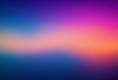 The primary subject of the image is a colorful sky, featuring a mix of purple, pink, and blue hues. The sky appears to be a backdrop for a sunset, creating a serene and picturesque scene. The visual style of the image is a combination of photo and digital art, as it captures the beauty of the sky and its colors. The overall atmosphere of the image is one of tranquility and natural beauty.