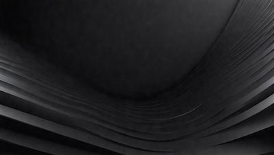 The primary subject of the image is a black and white photo of a spiral staircase. The setting is a dark room, and the visual style is a black and white photograph. The colors and mood of the image are predominantly dark and moody, with the spiral staircase being the main focal point.