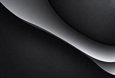 The primary subject of the image is a black and white photo of a curved surface, possibly a wall or a piece of art. The setting is a dark room, and the visual style is a close-up of the curved surface. The colors and mood of the image are predominantly black and white, creating a dramatic and artistic atmosphere.