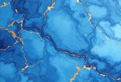 The primary subject of the image is a blue and gold marbled surface, which appears to be a piece of art or a decorative item. The setting is a blue background, which complements the blue and gold colors of the marbled surface. The visual style of the image is a close-up of the marbled surface, showcasing its intricate patterns and textures. The colors and mood of the image are predominantly blue and gold, creating a sense of elegance and sophistication.