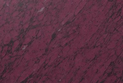The primary subject of the image is a marble surface with a purple hue. The setting is a close-up of the marble, showcasing its texture and color. The visual style is a realistic representation of the marble, capturing its natural beauty. The colors and mood of the image are predominantly purple, creating a sense of elegance and sophistication.