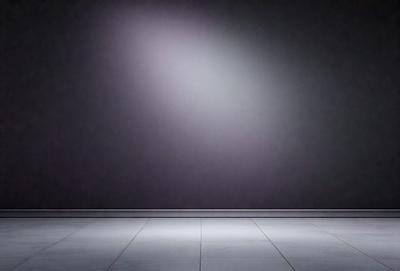The primary subject of the image is a bright light shining on a purple wall. The setting is a dark room with a purple wall, and the visual style is a photo. The colors and mood of the image are predominantly purple, creating a moody and dramatic atmosphere.