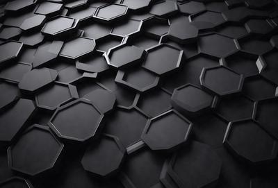 The primary subject of the image is a black and white patterned surface, which appears to be a wall or a floor. The setting is a dark room, and the visual style is a close-up of the patterned surface. The dominant colors are black and white, and the overall atmosphere is somewhat mysterious and intriguing.