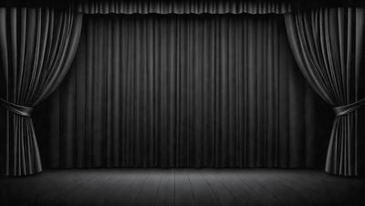 The primary subject of the image is a black curtain hanging in a theater. The setting is a stage with a black background, and the visual style is a black and white photo. The curtain is the main focus of the image, and the overall atmosphere is dramatic and theatrical.