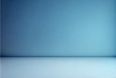 The primary subject of the image is a blue wall. The setting is a room with a blue wall, and the visual style is a photo. The dominant colors are blue, and the overall atmosphere is calm and serene.
