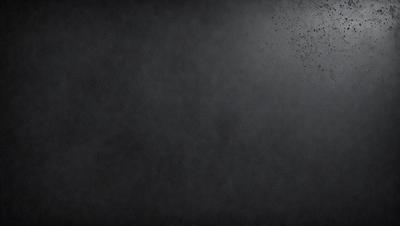 The primary subject of the image is a black background with a gray texture. The setting is a dark room, and the visual style is a black and white photo. The colors and mood of the image are dark and moody, creating a sense of mystery or drama.