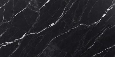 The primary subject of the image is a black marble countertop. The setting is a kitchen, with the countertop being the main focus of the scene. The visual style is a close-up of the marble countertop, showcasing its texture and pattern. The colors and mood of the image are predominantly dark, with the black marble countertop being the main source of contrast.