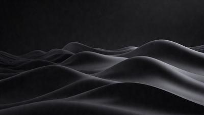 The image is a black and white photo of a mountain range. The mountains are depicted as a series of waves, giving the scene a dynamic and dramatic appearance. The overall atmosphere is one of serenity and natural beauty.