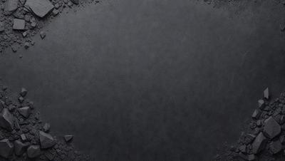 The primary subject of the image is a black surface, which appears to be a piece of leather or a black background. The setting is a dark room, and the visual style is a close-up of the black surface. The colors and mood of the image are predominantly dark and moody, with the black surface being the main focus.