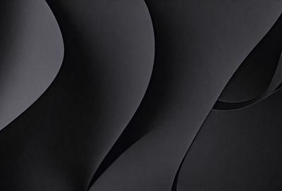The primary subject of the image is a black and white artistic representation of a spiral. The setting is a black background, which emphasizes the spiral's shape and form. The visual style is a combination of digital art and illustration, creating a unique and intriguing design. The colors and mood are predominantly black and white, giving the image a bold and striking appearance.