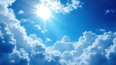 The primary subject of the image is a beautiful blue sky filled with fluffy white clouds. The setting is a clear day with a bright sun shining through the clouds. The visual style is a natural, outdoor scene with a focus on the sky and clouds. The colors and mood are serene and peaceful, with the blue sky and white clouds creating a calming atmosphere.