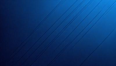The primary subject of the image is a blue background with a pattern of wires or cords. The setting appears to be a dark or dimly lit environment. The visual style of the image is a close-up of the blue background with the wires or cords. The colors and mood of the image are predominantly blue, creating a calm and serene atmosphere.