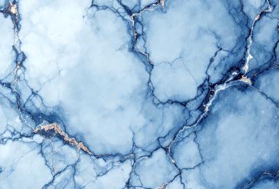 The primary subject of the image is a blue marble surface with a pattern of gold veins. The setting is a blue and white marble wall, which serves as the background. The visual style is a close-up of the marble surface, showcasing the intricate pattern of gold veins. The colors and mood of the image are predominantly blue and white, with a touch of gold, creating a serene and elegant atmosphere.