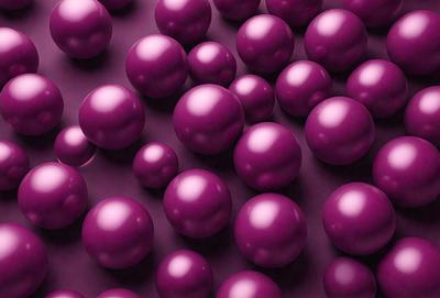 The primary subject of the image is a large group of purple balls, which are the main objects in the scene. The setting is a purple background, which creates a visually striking contrast with the balls. The visual style of the image is a close-up of the balls, showcasing their unique texture and color. The dominant colors in the image are purple, which creates a calm and soothing atmosphere.
