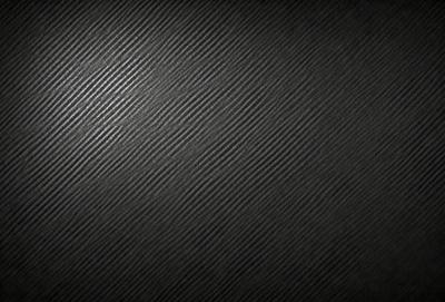 The primary subject of the image is a black and white patterned surface. The setting is a black background, and the visual style appears to be a pattern or texture. The dominant colors are black and white, creating a mood of simplicity and elegance.