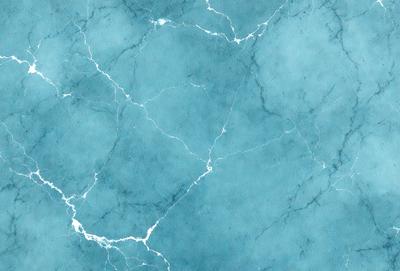 The primary subject of the image is a blue marble wall with a pattern of white and blue veins. The setting is a room with a blue-green marble wall, which creates a unique and visually appealing atmosphere. The visual style of the image is a close-up of the marble wall, showcasing the intricate patterns and textures. The colors and mood of the image are predominantly blue and green, giving it a calm and serene ambiance.