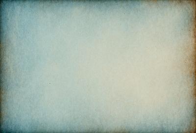 The primary subject of the image is a large, white sheet of paper. The setting is a room with a blue wall, and the visual style is a close-up of the paper. The colors and mood of the image are predominantly blue, creating a calm and serene atmosphere.