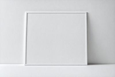 The primary subject of the image is a white square or rectangle, which is the main object, scene, or focus of the image. The setting or background is a white surface, which could be a wall or a piece of paper. The visual style of the image is a simple, clean, and minimalist design, with no visible photo, digital art, illustration, drawing, pattern, texture, or clipart. The colors and mood of the image are predominantly white, giving it a clean and uncluttered appearance.