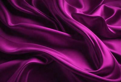 The primary subject of the image is a purple fabric, which is the main object, scene, or focus of the image. The setting or background is a purple curtain, and the visual style is a close-up of the purple fabric. The colors and mood of the image are predominantly purple, creating a calm and serene atmosphere.