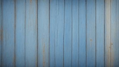 The primary subject of the image is a blue wall with a wooden texture. The setting is a room with a blue wall, and the visual style is a photo. The dominant colors are blue and brown, creating a calm and soothing atmosphere.