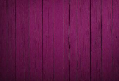 The primary subject of the image is a purple wooden wall. The setting is a room with a purple wooden wall as the main focus. The visual style is a close-up of the purple wooden wall, which gives a sense of depth and texture. The colors and mood of the image are predominantly purple, creating a calm and soothing atmosphere.