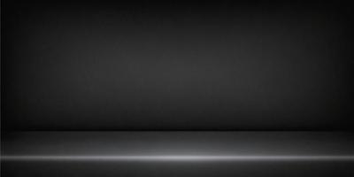 The primary subject of the image is a black background. The setting is a dark room, and the visual style is a black and white photo. The colors and mood of the image are predominantly dark and moody.