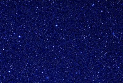 The primary subject of the image is the night sky, which is filled with stars. The setting is a dark, star-filled sky, and the visual style is a photo of the night sky. The colors and mood of the image are predominantly dark and serene, with the stars providing a sense of wonder and tranquility.