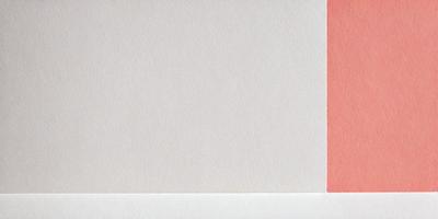 The primary subject of the image is a white piece of paper. The setting is a blank sheet of paper, with no visible background or environment. The visual style is a simple, clean, and minimalist representation of the paper. The colors and mood are predominantly white, giving the image a calm and uncluttered appearance.