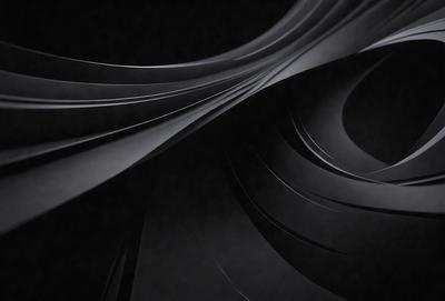 The primary subject of the image is a close-up of a black and white photograph of a spiral pattern. The setting is a dark background, which emphasizes the spiral pattern. The visual style is a black and white photograph, giving it a classic and timeless appearance. The colors and mood of the image are predominantly black and white, creating a sense of depth and contrast.